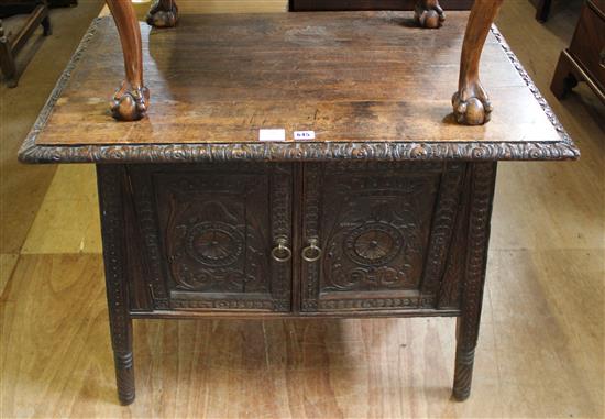 Carved oak low cupboard(-)